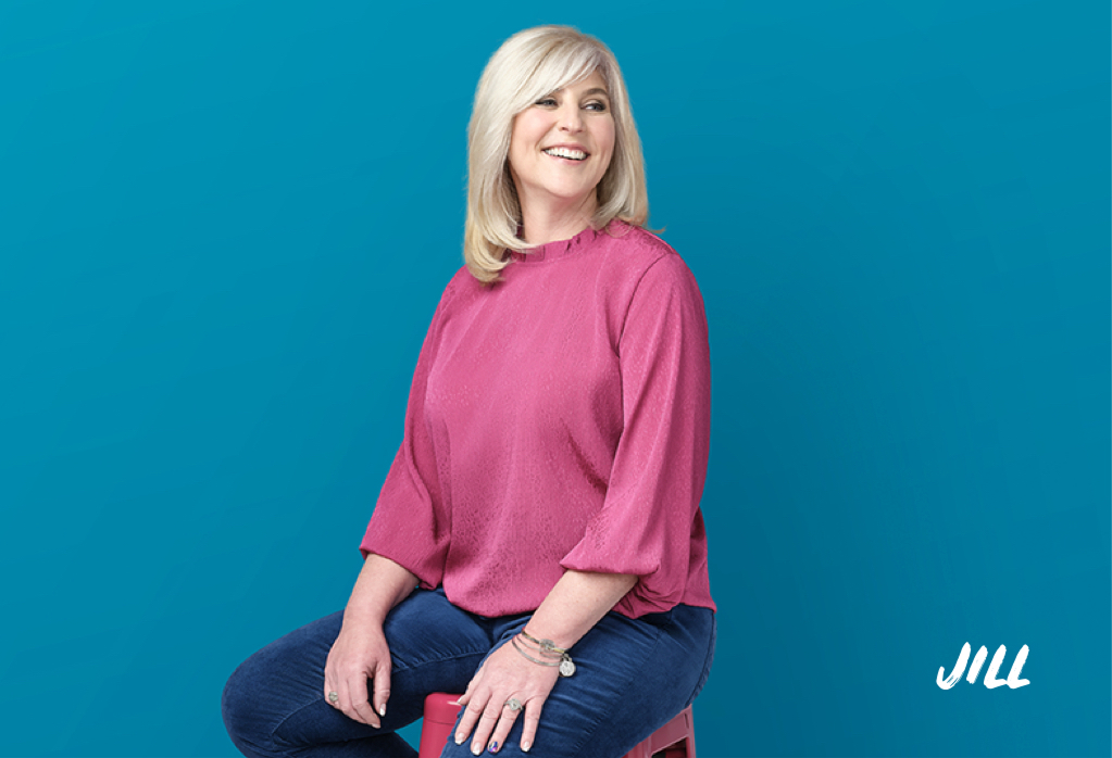Woman with pink shirt on blue background