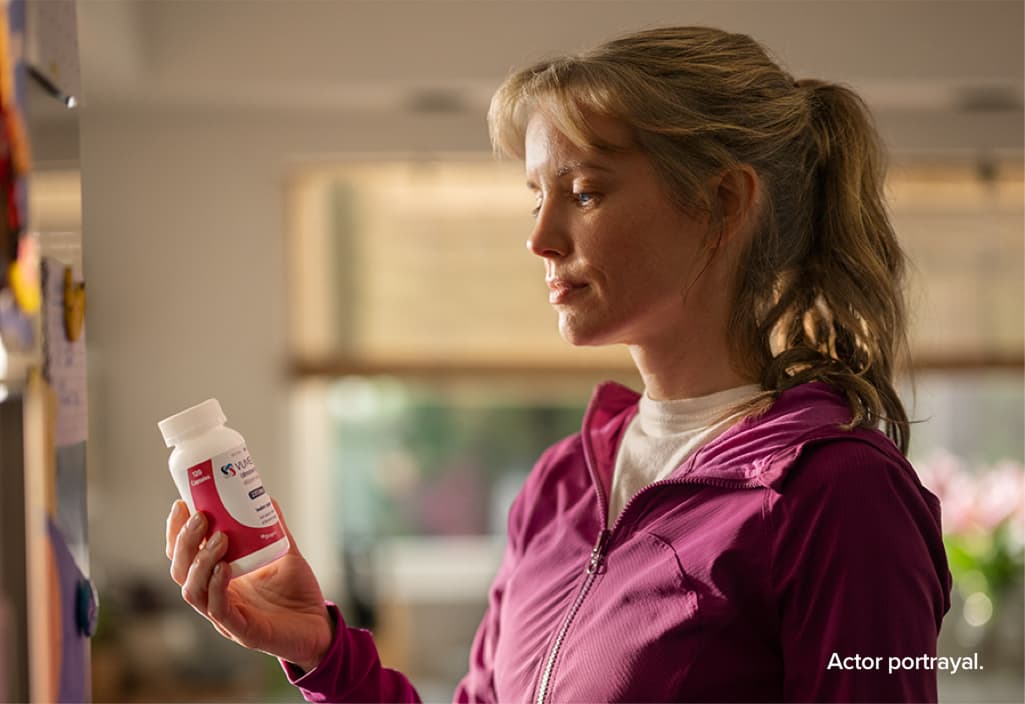 Woman with pill bottle