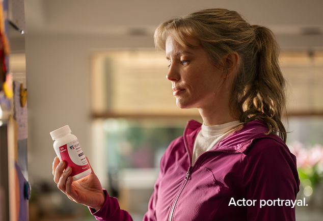 Woman with pill bottle